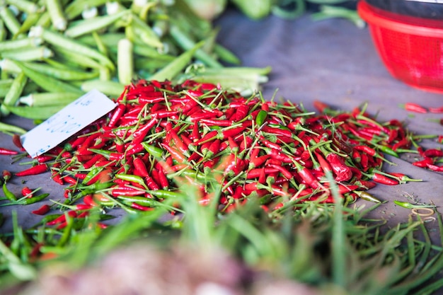 Photo close-up of red chili peppers for sale in market