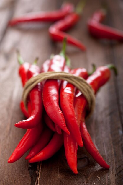 Close-up of red chili peppers on table