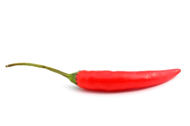 Close-up of red chili peppers on white background