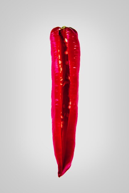 Photo close-up of red chili over white background