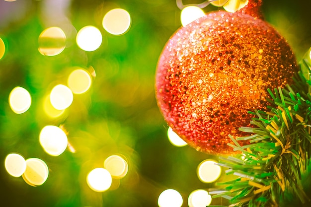 Close up red Christmas ball decoration on bokeh background Colorful blur bokeh background christmas background