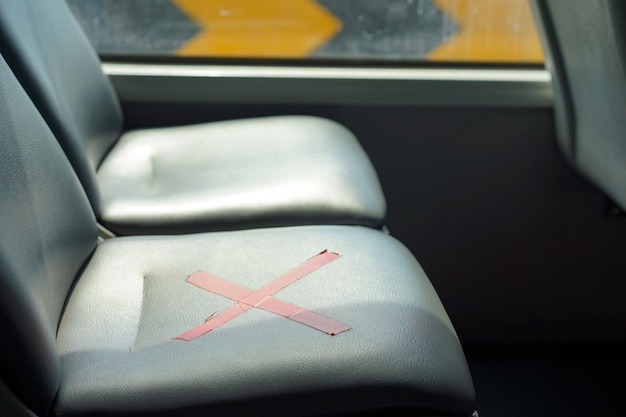 Close up to Red Cross symbol on Chair inside the Bus in CoronaVirus period