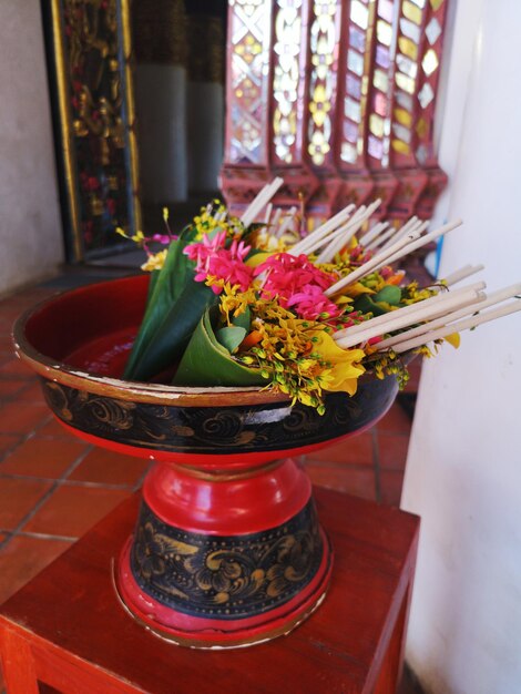 Close-up of red flower vase on table