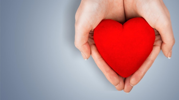 Close-up red Heart in female hands, love concept