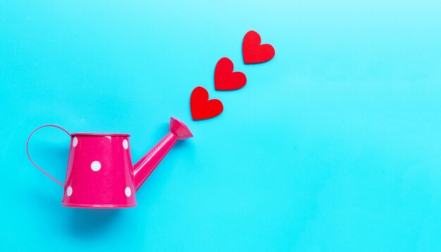 Close-up of red heart shape on blue table