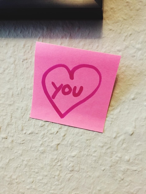 Close-up of red heart shape on wall