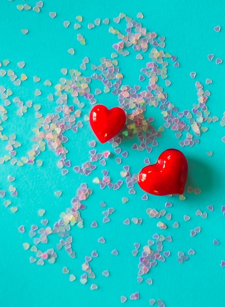 Close-up of red heart shapes on blue background