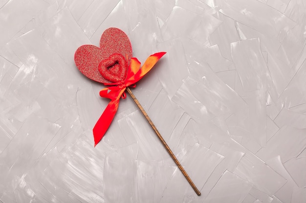 Photo close up of red hearts on wooden table against defocused lights st valentine's day background