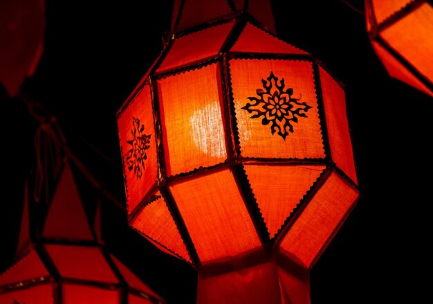 Photo close-up of red lantern illuminating in the street