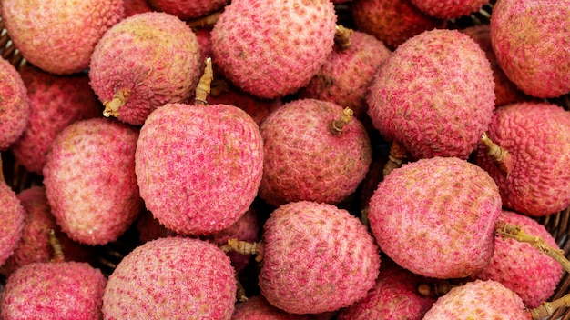 Close up of red lychee fruit.