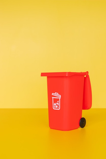 Close-up of red mailbox against yellow background