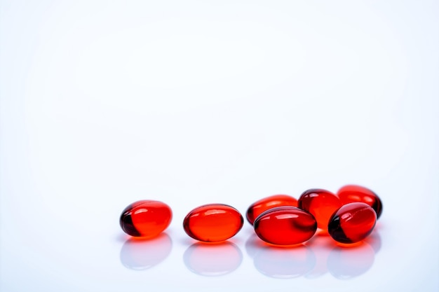 Photo close-up of red medicines on white background