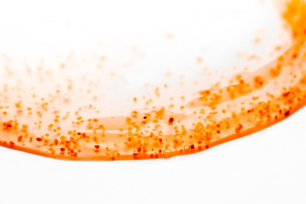 Photo a close up of a red and orange soap on a white surface