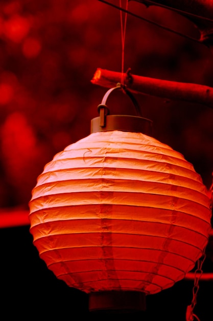 Close-up of red paper lantern hanging outdoors