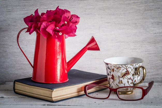 Close-up of red rose in vase on table