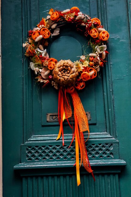 Close-up of red roses hanging on door