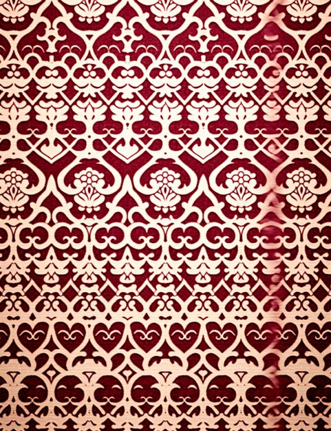 A close up of a red and white wallpaper with a pattern generative ai