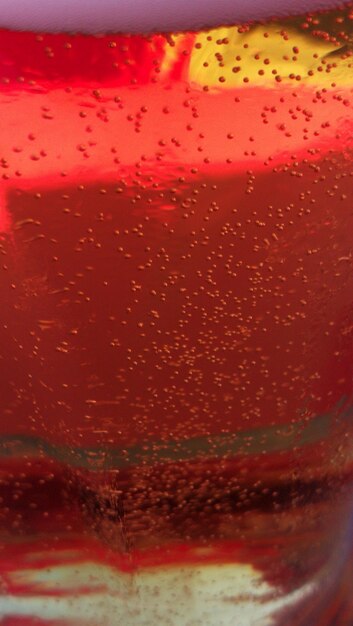 Close-up of red wine in water