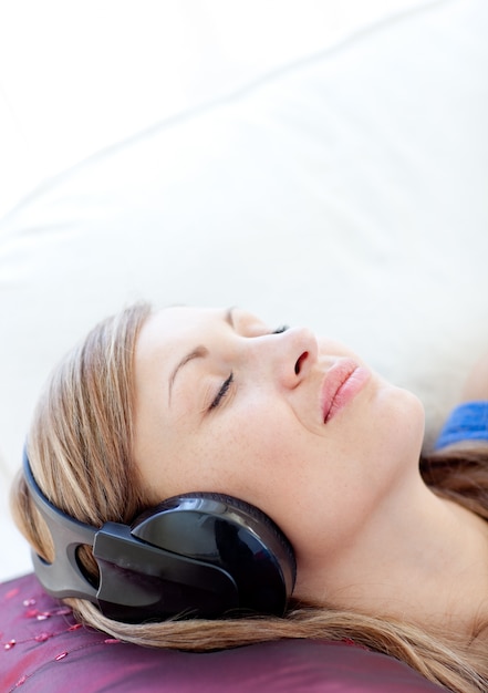 Close-up of a relaxed woman listening music 