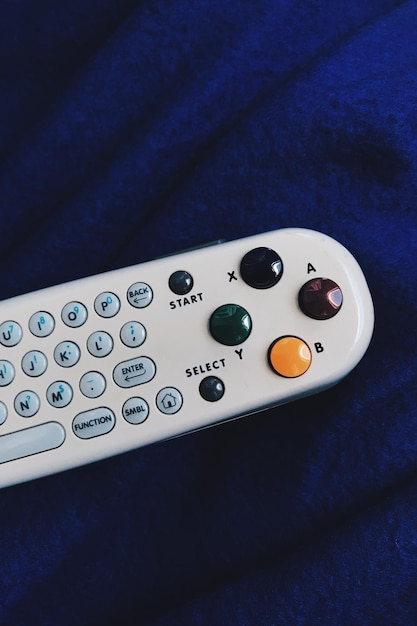 Photo close-up of remote control on textile