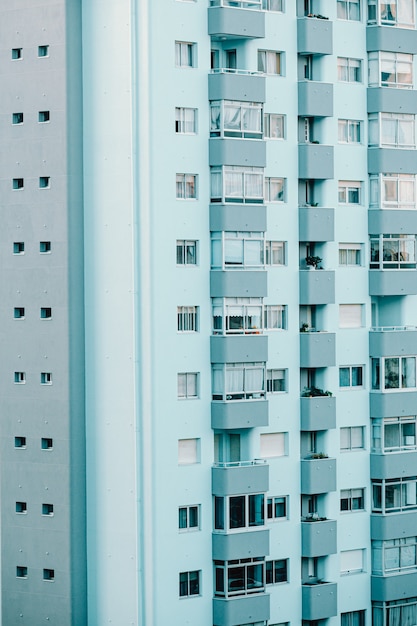 A close up of a repetitive building on blue tones with copy space and cinematic ambient