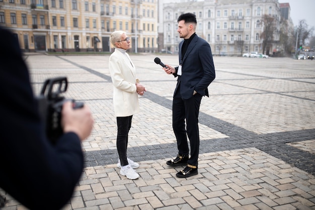 Photo close up on reporter taking an interview