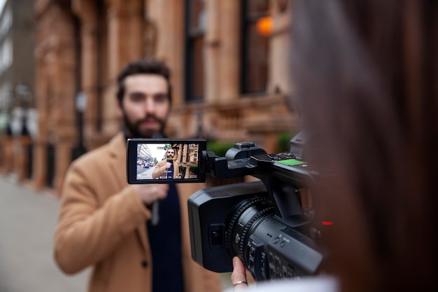 Close up reporters with equipment