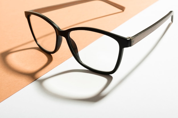 Photo close-up retro eyeglasses with shadow