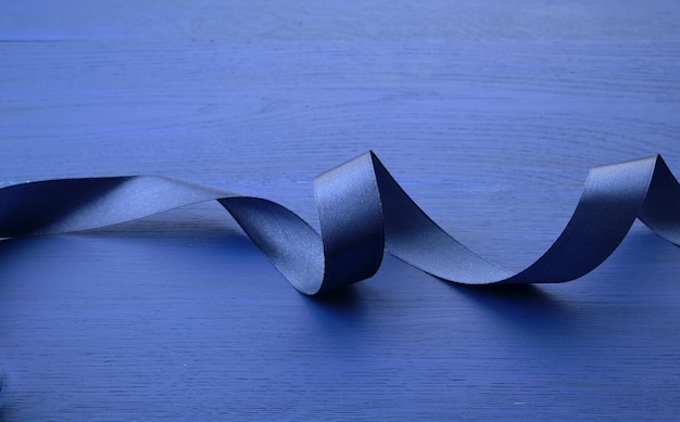 Photo close-up of ribbon on blue background