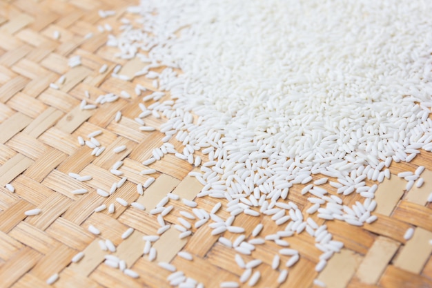 Close up rice grain on wooden basket