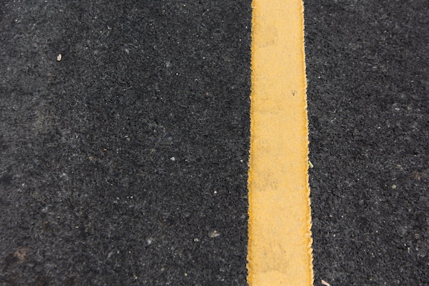 Close up road divide yellow line