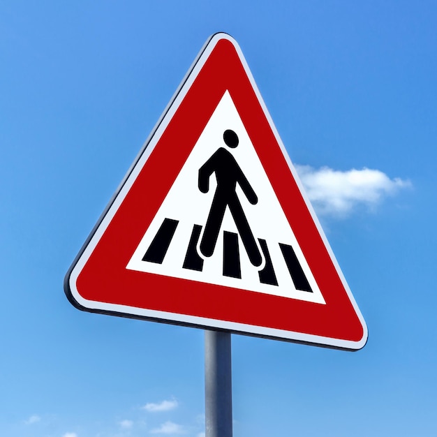 Photo close-up of road sign against blue sky