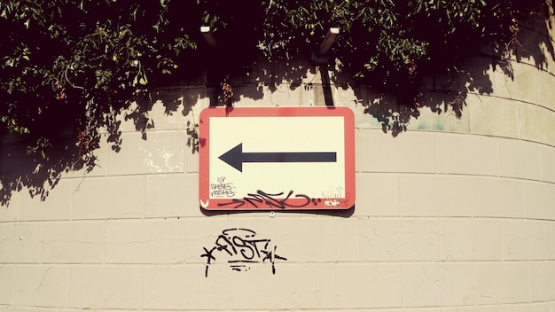 Close-up of road sign against trees