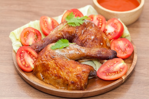 close up of roast wing chicken with sauce