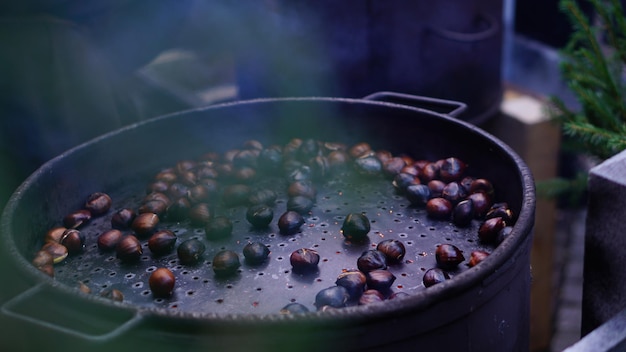 Close-up of roasted chestnuts in container