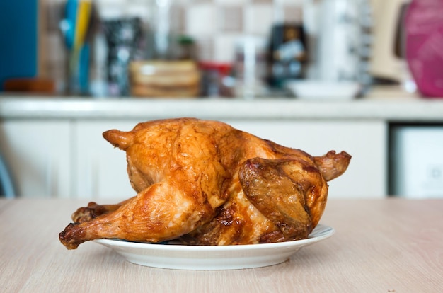 Close-up of roasted chicken on table