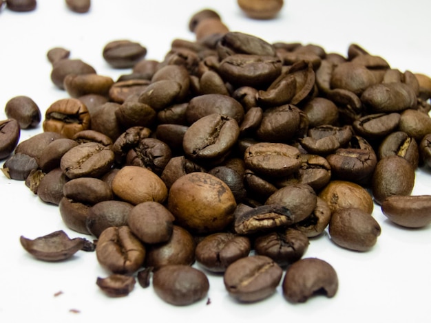 Close-up of roasted coffee beans on table