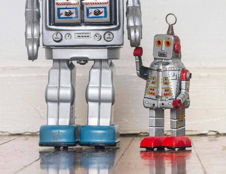 Photo close-up of robot toys against wall