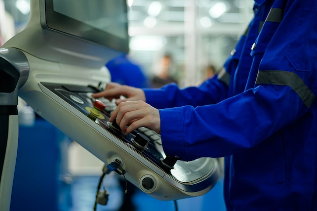 Close up of Robotics engineers Using Controller to Remotely Operate programming