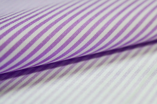 Close up roll purple and white strip fabric of shirt