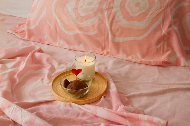 Photo close up on romantic breakfast bed arrangement