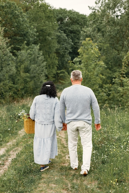 Close up romantic couple walking in an autumn park