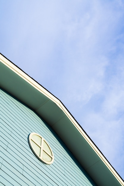 Close up of the roof of the house with sky background