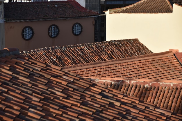 close-up of  roofs of building and round windows