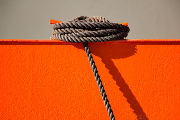 Close-up of rope on orange metal