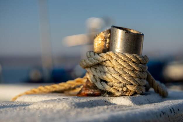 Close-up of rope tied on metal in boat