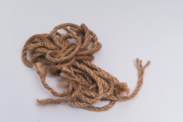 close-up of rope tied on white background