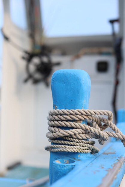 Close-up of rope tied on wooden post