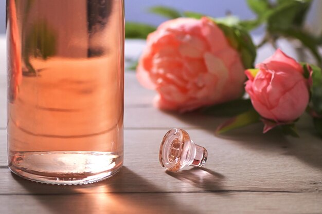 Close-up of roses in glass on table