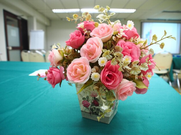 Close-up of roses in vase on table